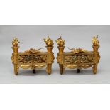 A pair of Louis XVI taste gilt bronze chenets, 20th century, each with a pair of flaming urns and