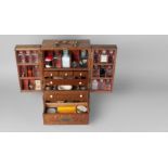 A large oak apothecaries cabinet, 19th century, with brass handle, the two doors above a silver