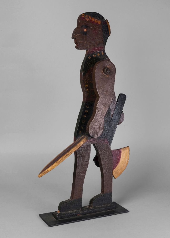 An American whirligig in the form of a Native Indian, 20th century, the hands holding an axe and
