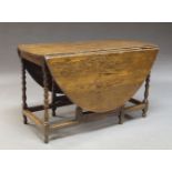 An oak gate-leg table, late 17th/early 18th century, the circular top above bobbin-turned