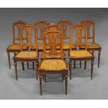 A set of eight burr walnut and gilt metal mounted single dining chairs of French Taste, 19th