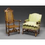 A Dutch style caned beech armchair, some elements 17th Century, the pierced crest with carved