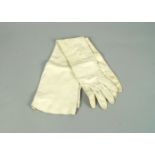 A pair of long white leather evening gloves, early 20th century, 56cm long (VAT charged on hammer