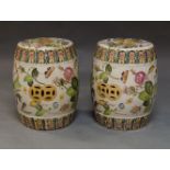 A pair of Chinese glazed garden seats, 20th Century, of drum form, decorated with flowers and