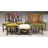 A set of six Edwardian Adam taste dining chairs, with pierced lyre shaped splats inset with patera