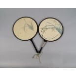 A pair of Chinese fans, 20th century, of circular form, the leaves painted with orchids on silk,