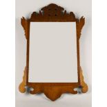 A Chippendale taste mahogany pierced mirror, late 19th century, of scrolling outline, 64.5cm high