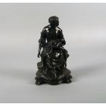 A bronze model of a young woman, 19th century, gathering flowers in her lap, seated on a naturally