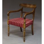 A Regency style bar back armchair, 20th Century, with scrolling arms, and red upholstered seat, on