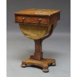 A Victorian mahogany work table, the rectangular top above single frieze drawer, over sliding