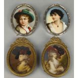 A pair of German or Austrian portraits of young boys, 19th century, on oval porcelain panels, in