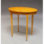 An Edwardian satinwood and painted side table, the oval top with floral painted decoration, on