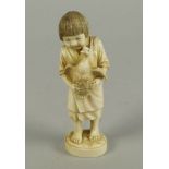 A Japanese ivory figure of a girl holding a goose, late 19th/early 20th century, signed to base,