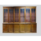 A mahogany and glazed breakfront bookcase, early 19th Century, the moulded cornice above six