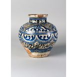 A Mamluk pottery jar, Syria, 15th century, of baluster form, decorated in cobalt blue, black and