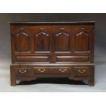 A George III oak mule chest, later adapted to have pair of cupboard doors above three base drawers