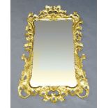 A George II style gilt wood mirror, of recent manufacture, the pierced frame with carved foliate and