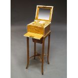 An Edwardian satinwood and ivory inlaid vanity cabinet, early 20th century, the top with lifting lid