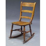 A mahogany slat back children's rocking chair, late 19th , early 20th Century