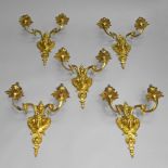 A set of five gilt metal twin light wall lights, in the Adam taste, late 20th century, the back