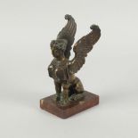 A French bronze model of a Sphinx, late 19th century, modelled with spreading wings, seated on her