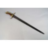A Continental composite sword, early 19th century and earlier, the brass and beech wood handle