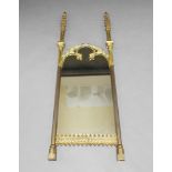 A gothic taste mirror in the manner of A W Pugin, elements 19th Century, with shaped mirror plate