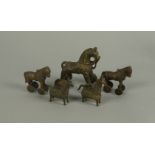 Three Indian bronze temple toys in the form of horses, 19th century, together with two other