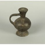 A Pre-Columbian style globular jar, with elongated loop handle, with moulded spandrels to the