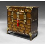 A Korean softwood cabinet, late 19th century, with four frieze drawers above pair of central