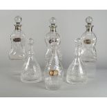 A Georgian glass decanter, the stopper with a heart shaped finial, with cut decoration, 28cm high,