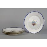 A set of four English porcelain plates, late 19th century, later decorated with the armorial crest