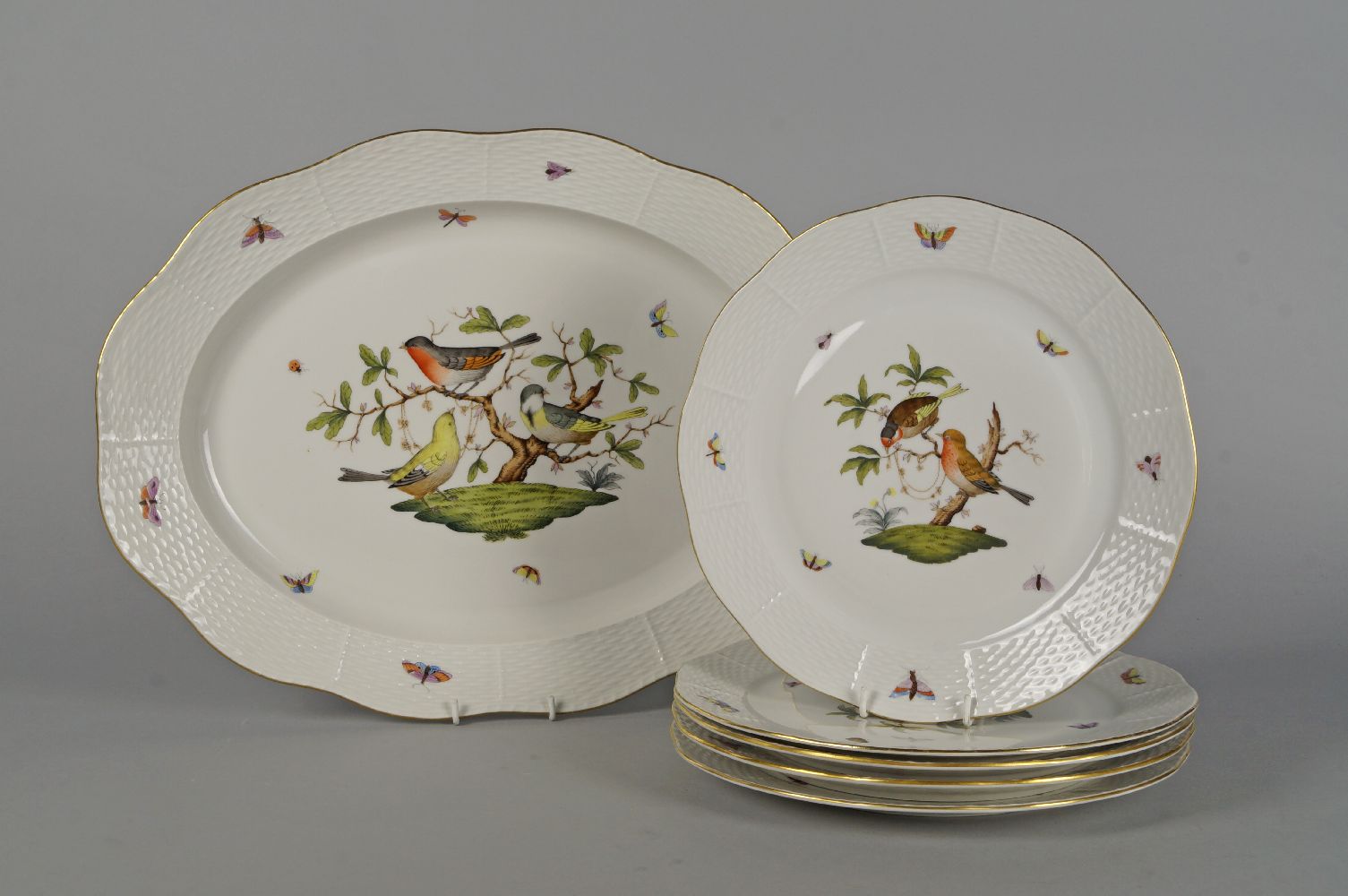 A Herend porcelain oval meat dish, 20th century, moulded to the rim with basket weave design,
