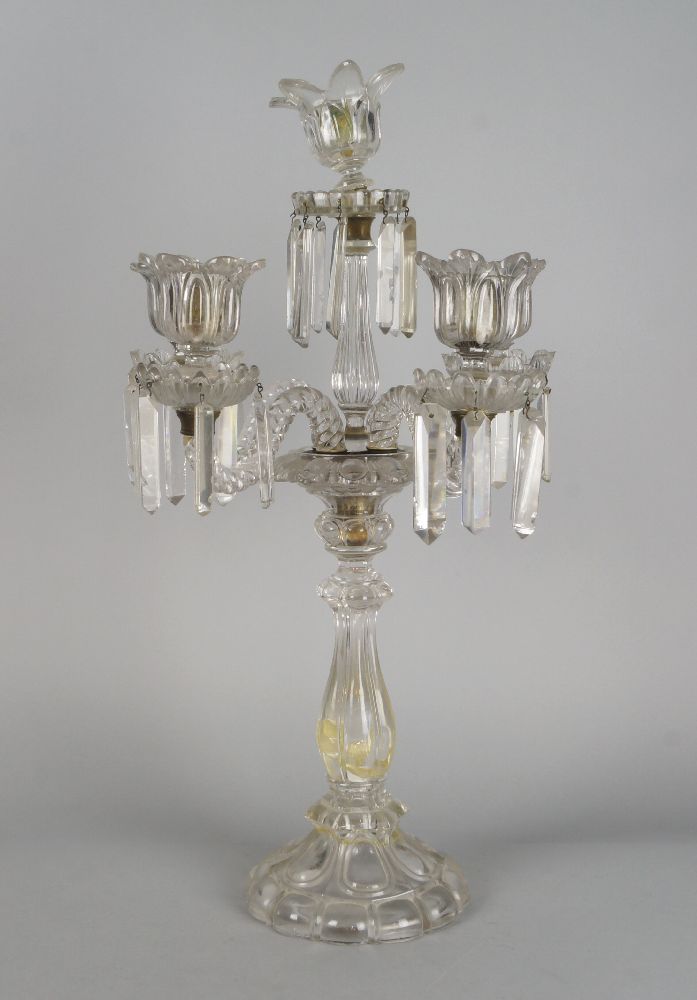 A large five light glass candelabra, 19th century, with a central facetted baluster column on