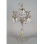 A large five light glass candelabra, 19th century, with a central facetted baluster column on