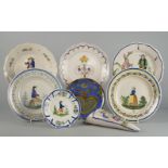 A pair of Quimper pottery plates by Henriot, 20th century, decorated to the centres with male and
