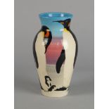 A Dennis China work pottery vase decorated with penguins and their chicks designed by Sally