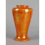 A Ruskin orange lustre vase, impressed mark to base, 28cm high crack to neck