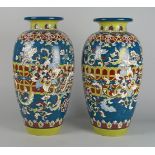 A pair of Japanese satsuma vases, early 20th century, enamelled and decorated with bands of