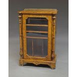 A Victorian figured walnut music cabinet, the rectangular top with gilt metal gallery to back, above