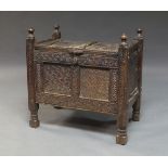 A Middle Eastern chip carved chest, late 19th/20th century, with four corner stiles with turned