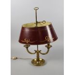 A French taste twin light bouillotte lamp, 20th century, the shade painted with red lacquer and gilt