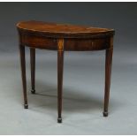 A George III mahogany and inlaid demi lune tea table, the crossbanded top inlaid with half fan