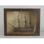 A model of a ship, 19th century, with three masts and a long yard arm, set on a stand as if in dry