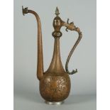 A copper pot, late 19th/20th century, possibly Syrian, with long animal form handle and long