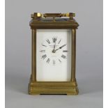 A brass carriage clock, 20th century, of typical form, the white enamel dial with Roman chapter