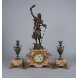 A French bronzed spelter and pink marble clock garniture, late 19th century, the clock mounted