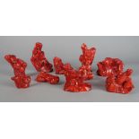 A collection of Chinese coral specimens, 20th century carved with mythical creatures, dragons, fish,