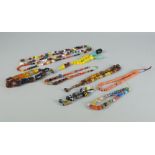 A collection of strung beads and trade beads, including mosaic glass, Roman beads, amber, amber