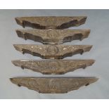 A group of five South East Asian wooden carved lintels, late 19th/20th century, with central